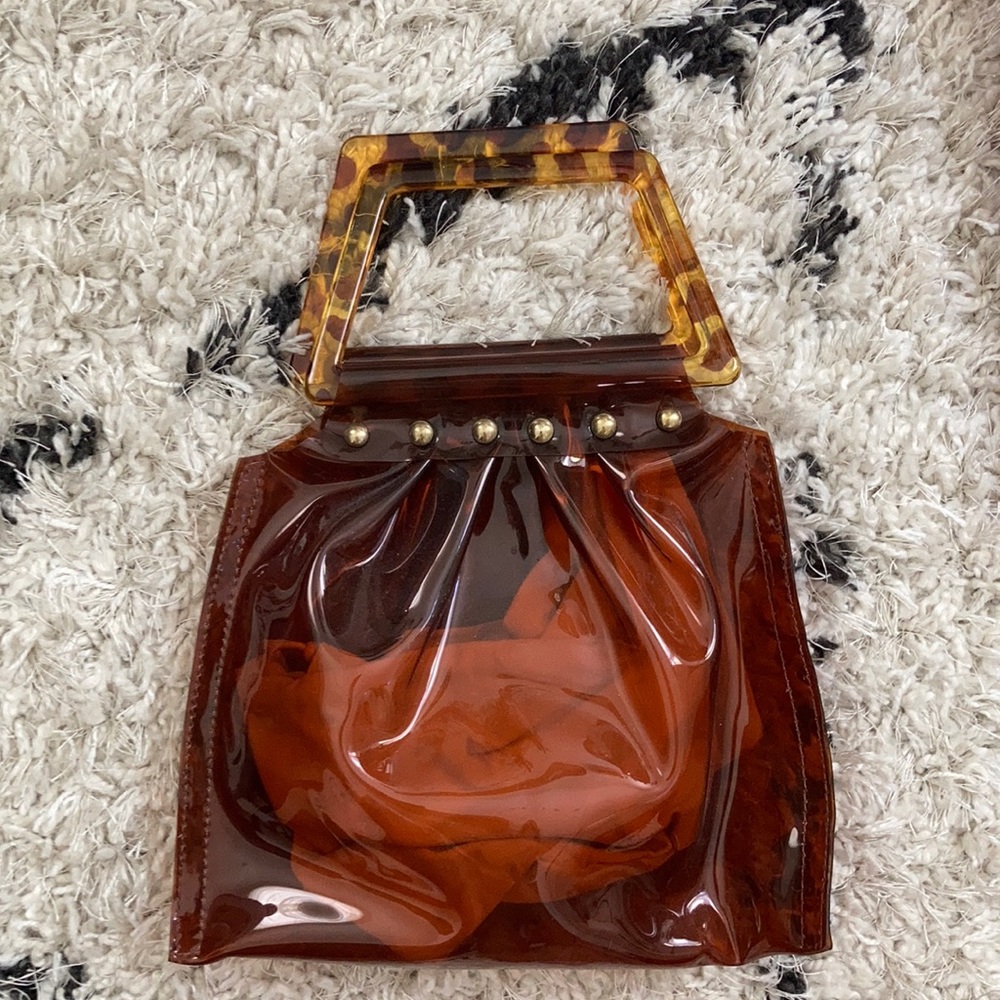 Clear vinyl bag with tortoise handle